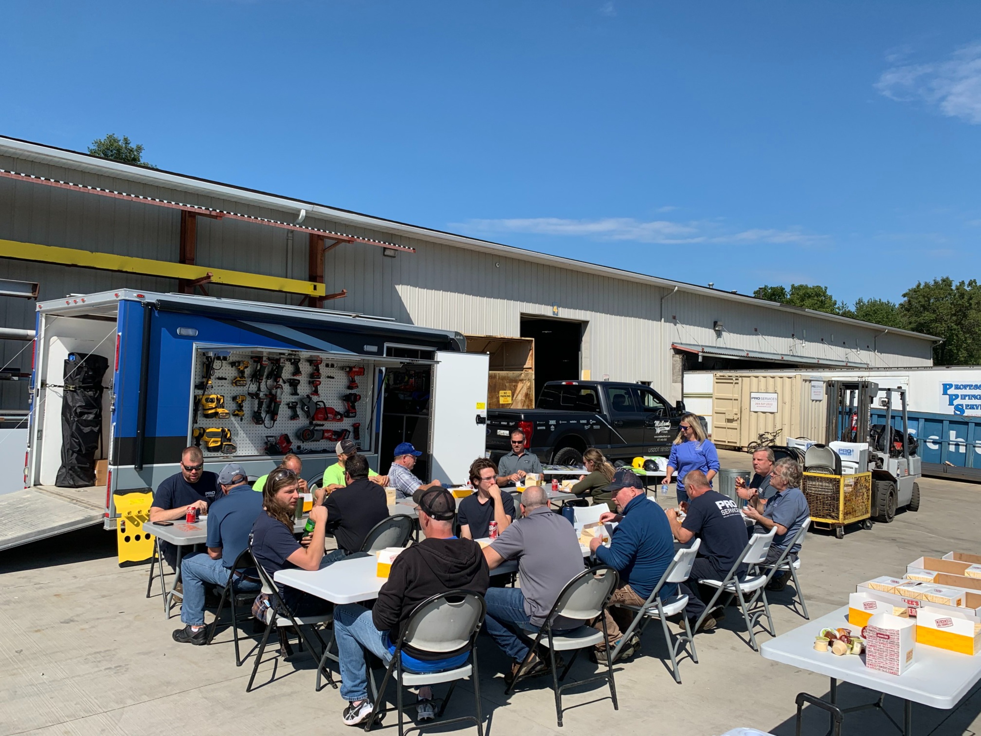 Workers eating lunch at on-site product demo